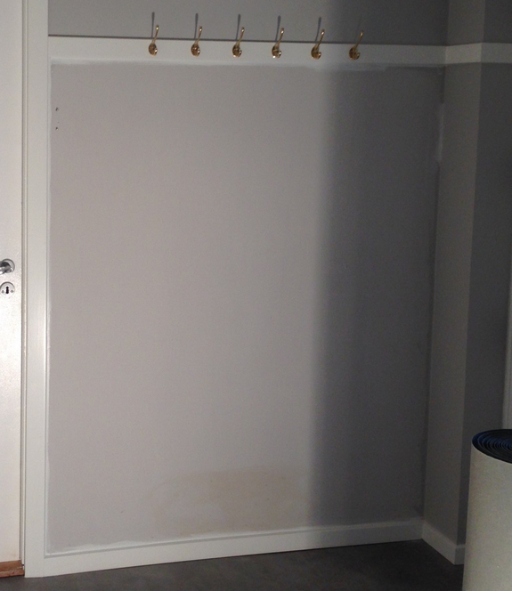 Tapetsering af væg i Odense